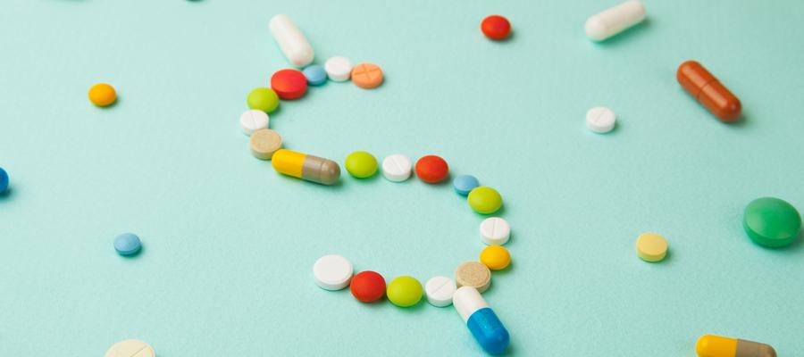 Pills in the shape of a dollar sign